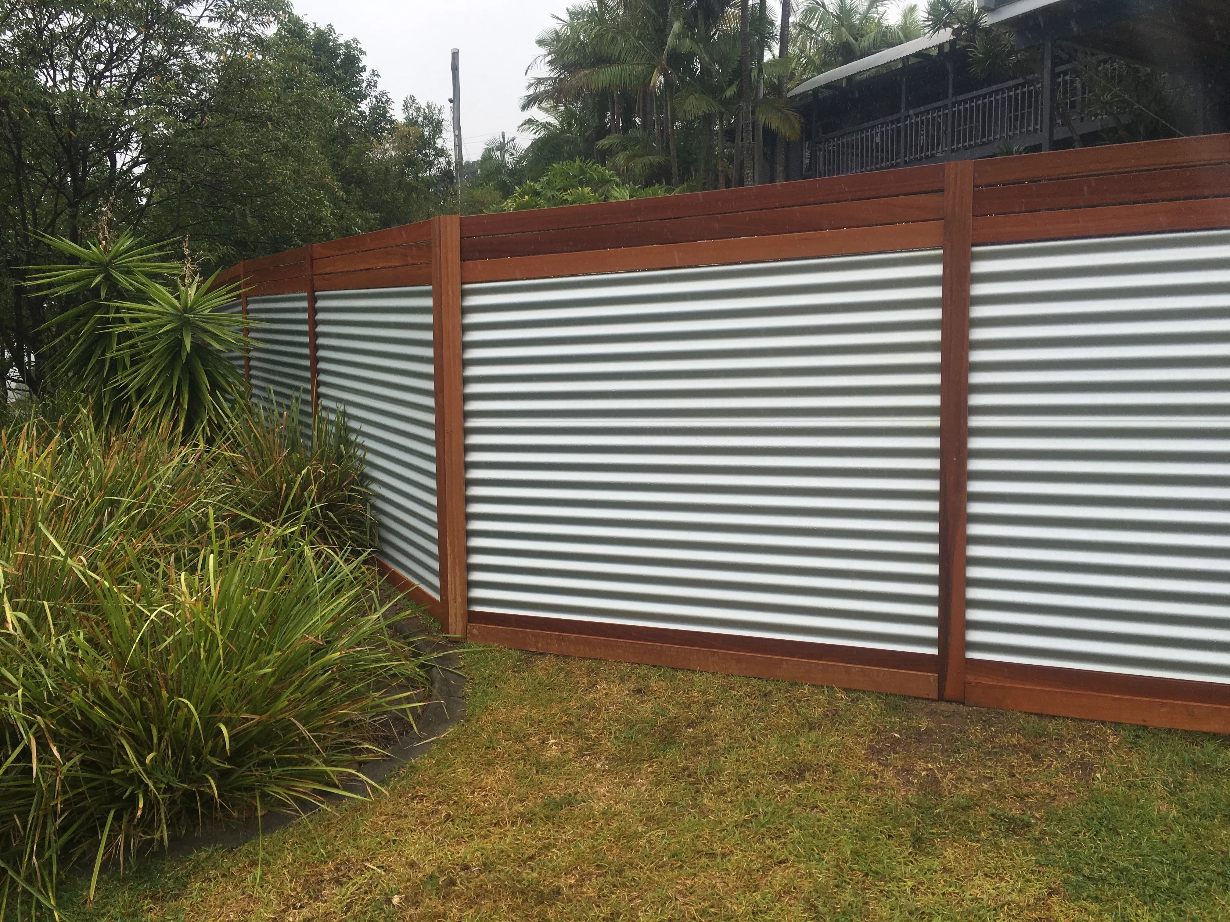 Hardwood and aluminium panel fence